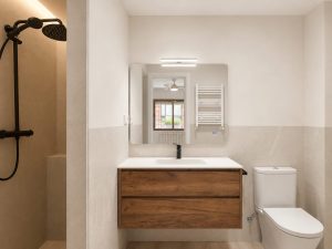 Baño de invitados con grifería negra – reforma integral de vivienda en Torrelodones